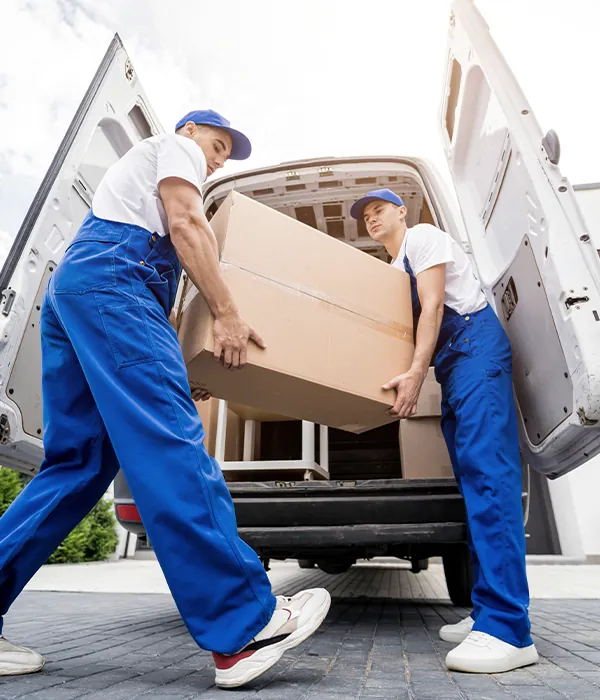 Two removers loading a van.
